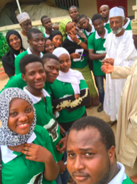 Young women and men from MR CITY Lab take a selfie during their community outreach for restoring indigenous tree species in Kano city, Nigeria.